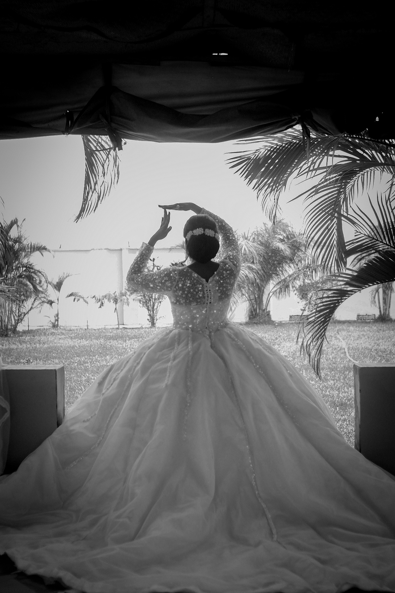 Bride in a beaded ballgown photographed from behind